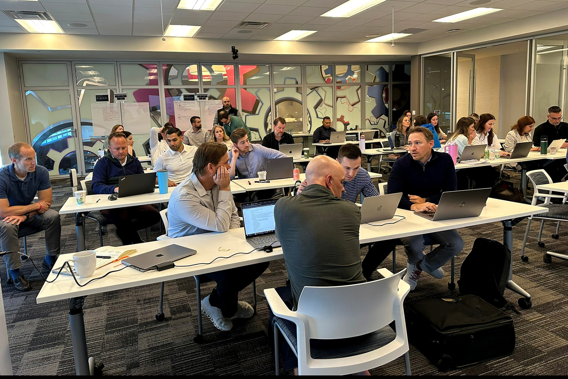 A full room of people working on tasks of their own